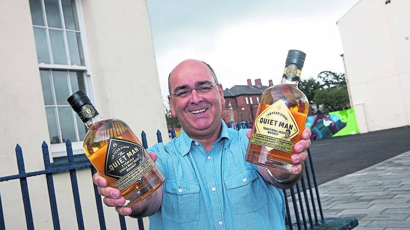 MILESTONE: Ciaran Mulgrew with &#39;An Fear Giuin&#39; or &#39;The Quiet Man&#39; whiskey named in memory of his father John 