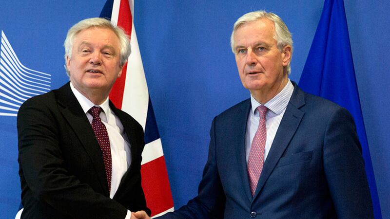 European Union chief Brexit negotiator Michel Barnier, right, shakes hands with British Secretary of State for Exiting the European Union David Davis prior to a meeting at EU headquarters in Brussels today