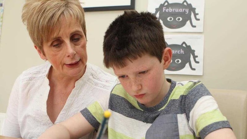 Eithne McVerry helps care for her eight-year-old grandson Neil, who was diagnosed with ASD at the age of three Picture by Matt Bohill 