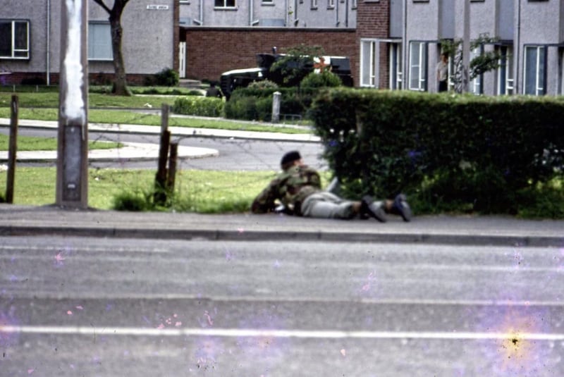 Soldiers take cover during a gun battle with the IRA in Lenadoon in 1972. 