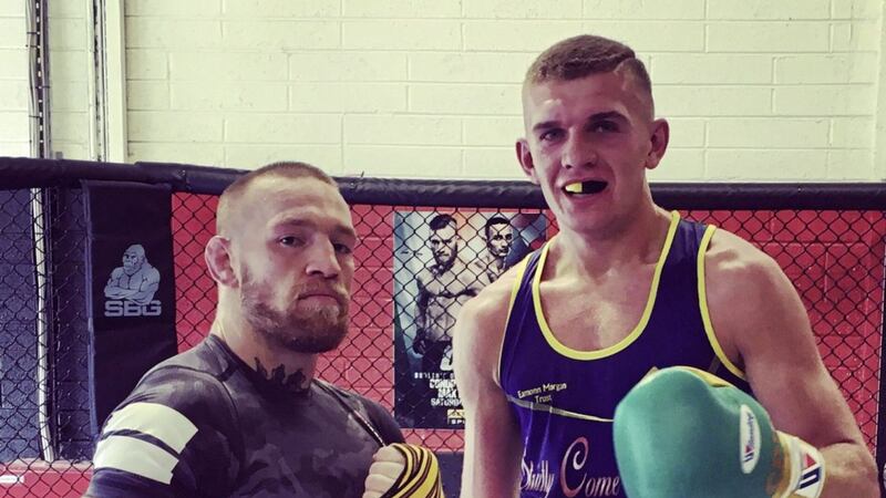 profile: Conor Wallace, right, with UFC star Conor McGregor who invited him to Las Vegas to help him train in 2016 