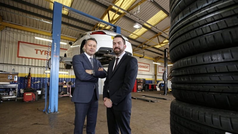 Charles Hurst Group after-sales operations director Andrew Gilmore (left) joins James Thompson, manager of the Sydenham Fast Fit branch. Photo: Darren Kidd/PressEye 