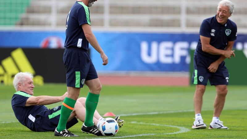 Republic of Ireland goalkeeping coach Seamus McDonagh is left on his backside by Roy Keane as kitman Mick Lawler looks on during Thursday's training session at the Stade de Montbauron in Versailles.&nbsp;Picture by AP&nbsp;