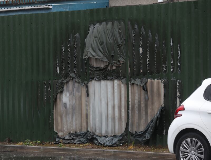 Damage caused to the fence as Police in south Belfast are investigating an arson attack at commercial premises, in the Diamond Gardens area of Finaghy, in the early hours of Thursday 28th March.

Officers received a report that at around 1am on Thursday morning, an accelerant had been poured over the fence of a garage yard in the area and set alight causing damage to six cars inside the yard. Damage was also reported to the fence at the property.
PICTURE COLM LENAGHAN