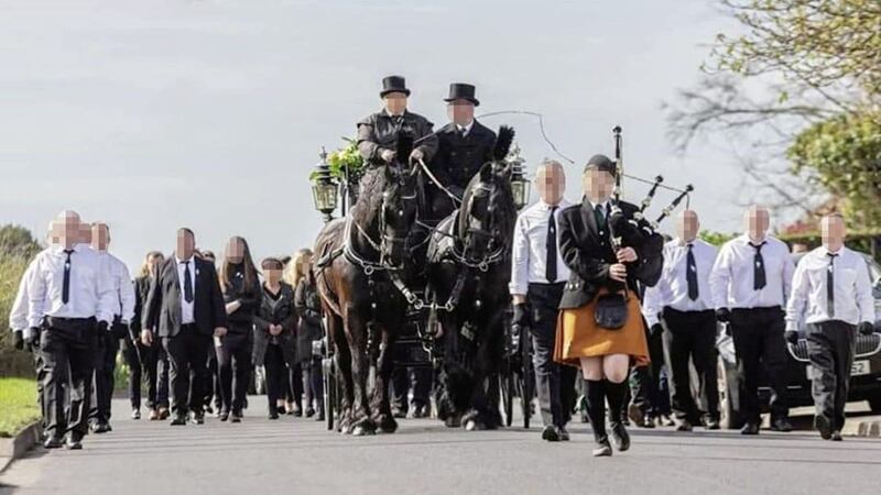 Black-gloved republicans marched alongside a horse and carriage carrying former Sinn F&eacute;in councillor Francie McNally&#39;s coffin to the graveyard in Coagh, Co Tyrone. 