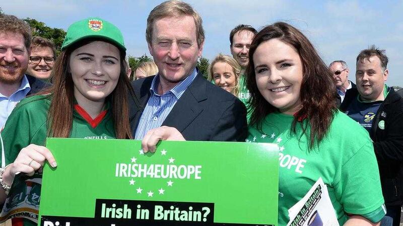 Taoiseach Enda Kenny with Kate Murphy (left) and Claire Tighe outside Irish TV GAA Grounds in London. Picture by John Stillwell, Press Association              