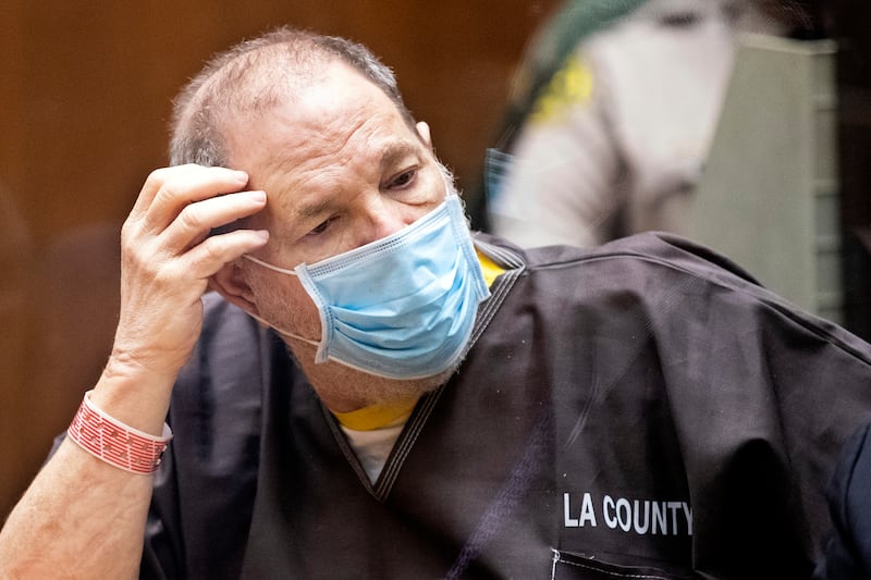 Harvey Weinstein wears a face mask as he listens in court during a pre-trial hearing in Los Angeles 