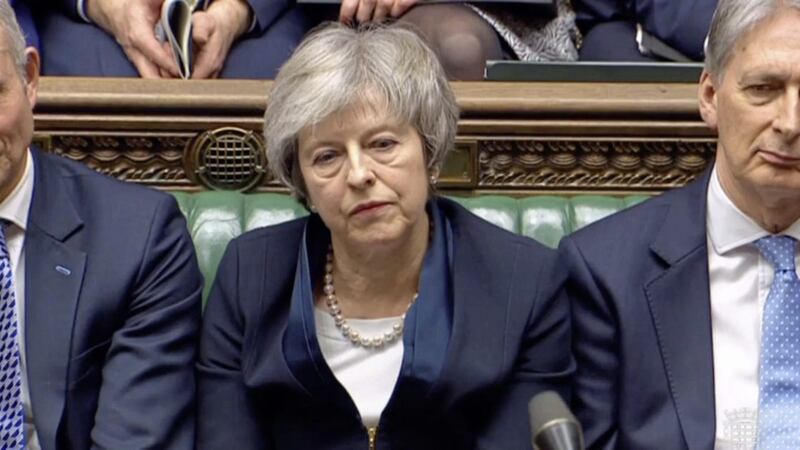 Prime Minister Theresa May listens to Labour leader Jeremy Corbyn speaking after losing a vote on her Brexit deal in the House of Commons. Picture by /PA Wire