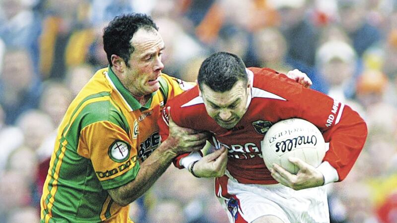 Donegal&#39;s Damien Diver gets to grips with Armagh&#39;s Oisin McConville during the counties&#39; 2006 Ulster Championship meeting. Picture by Ann McManus 