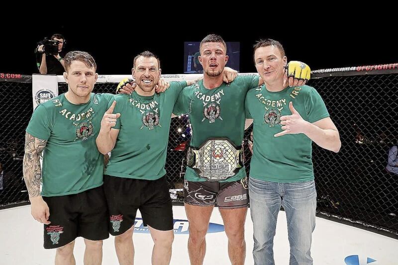 Karl Moore (second from right) won the Cage Fighters light-heavyweight title at 3Arena in Dublin last Saturday night 