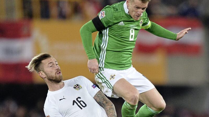 NI captain Steven Davis challenges Austria's Peter Zulj in Belfast.&nbsp;Picture by Colm Lenaghan/Pacemaker Press