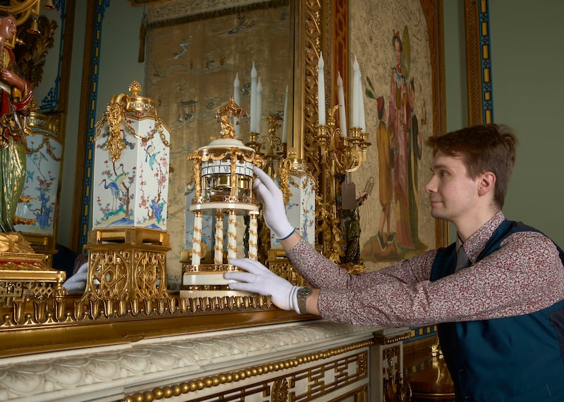A Horological Conservator adjusts alate-18th-century French marblemantel clock in the Centre Room inthe East Wing of Buckingham Palace (Royal Collection Trust / © His Majesty King Charles III 2024.)
