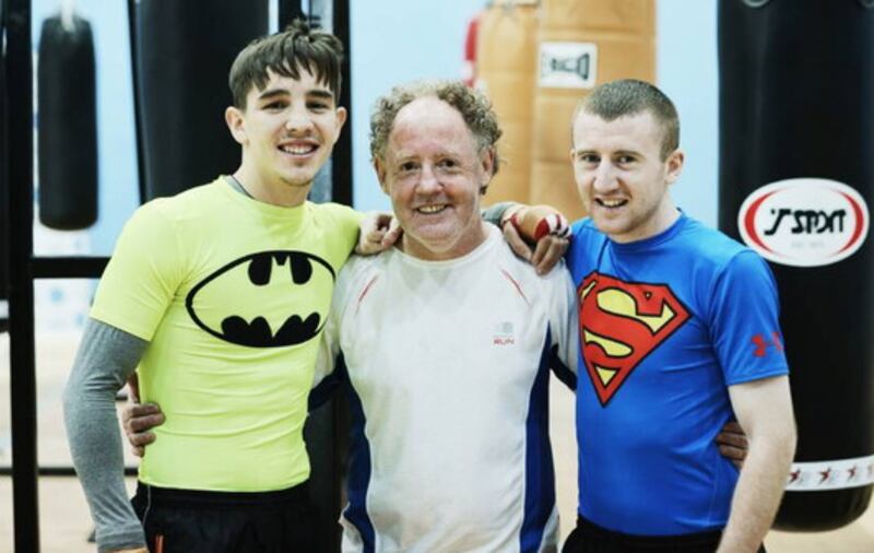 Hugh Russell pictured with boxers Michael Conlan and Paddy Barnes