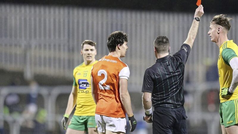 Donegal&#39;s Jason McGee and James Morgan of Armagh are red carded by referee Martin McNally after a brawl during the NFL match at Ballybofey. Picture Margaret McLaughlin. 