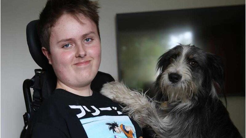 Josh Clarke pictured at home with family dog Tilly. Picture by Hugh Russell 