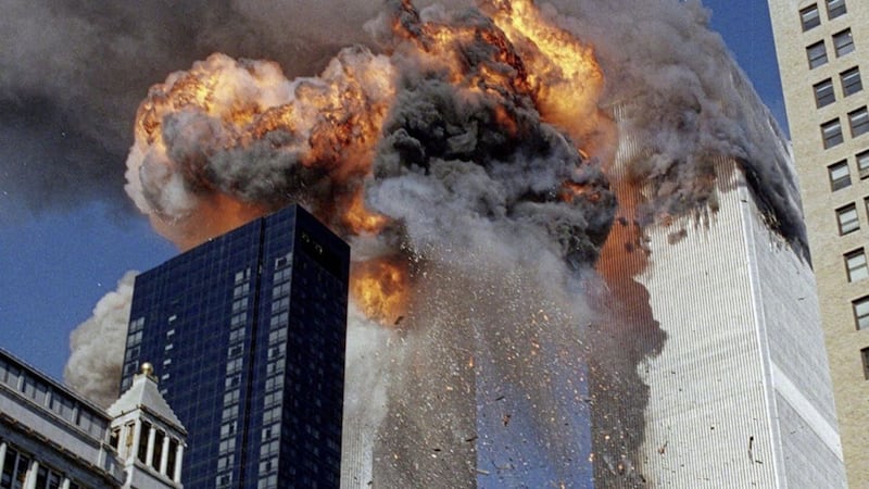 The World Trade Center towers attacks that killed more than 3000 people. Picture by AP Photo/Chao Soi Cheong  