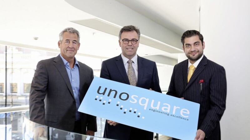 Alastair Hamilton, Invest NI Chief Executive (centre), is pictured with  Mike Barrett and Giancarlo Di Vece from  Unosquare, who are to create 100 new jobs in Belfast 
