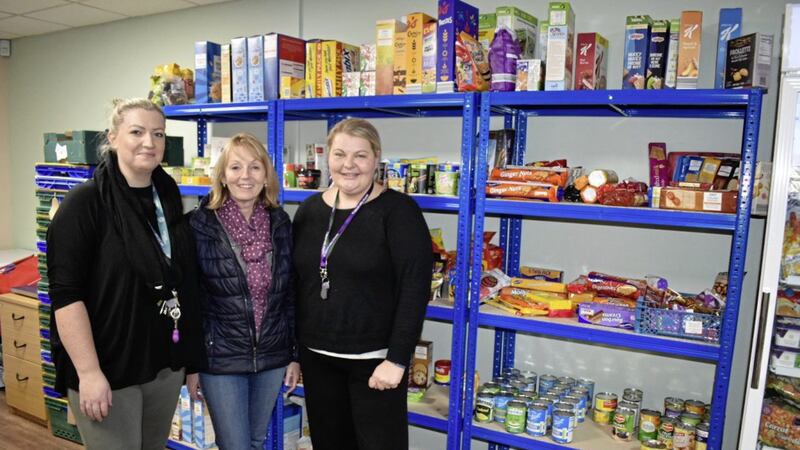 Lynsey Agnew, manager of the Lisburn social supermarket, with councillor Amanda Grehan and Alison Knox, a member of staff at the store 