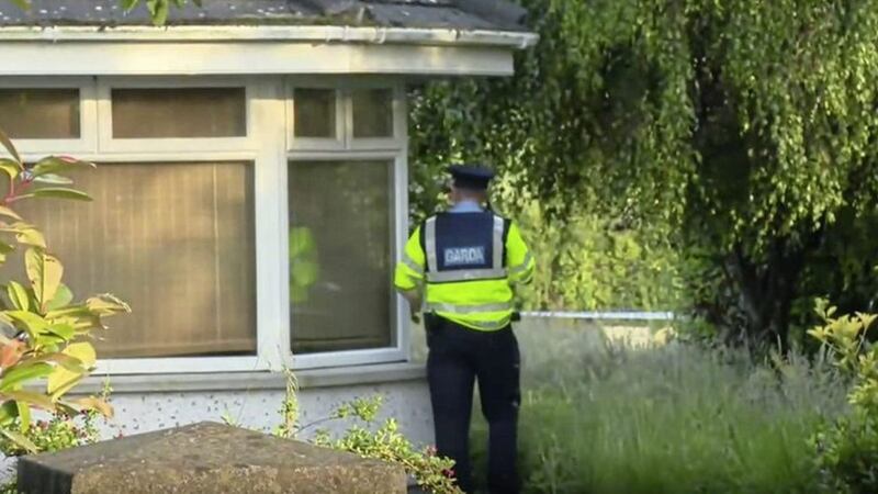 A garda officer outside the Co Tipperary home of a couple. Picture: RT&Eacute; 