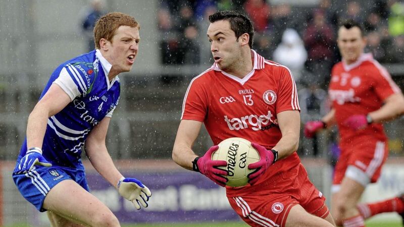 Tyrone&#39;s Kyle Coney runs up against Monaghan&#39;s Kieran Duffy. Picture by Michael Cullen. 
