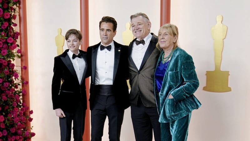 Henry Tadeusz Farrell, from left, Colin Farrell, Brendan Gleeson and Mary Gleeson arrive at the Oscars on Sunday at the Dolby Theatre in Los Angeles. Picture by AP Photo/Ashley Landis 