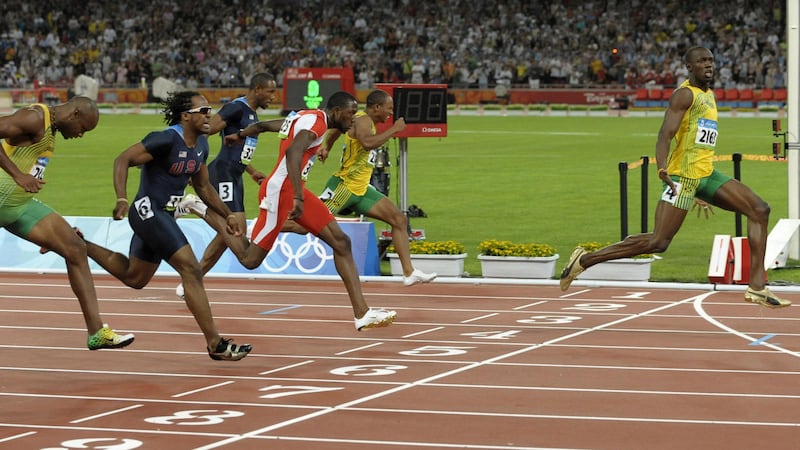 Usain Bolt crosses the line to win the 100m final at the 2008 Olympics in Beijing