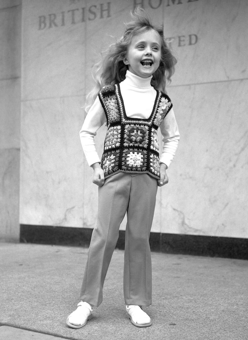a child wearing a crochet top in 1972
