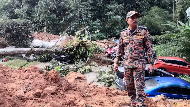 A Malaysian government investigation has concluded that a landslide which killed 31 people at an unlicensed campsite in 2022 was caused by persistent heavy rain, not human activity (Korporat JBPM/AP)