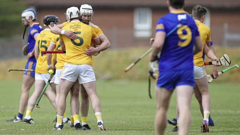 Antrim&#39;s Neil McManus and Paddy Burke celebrate after their win over Clare. Picture by Hugh Russell. 