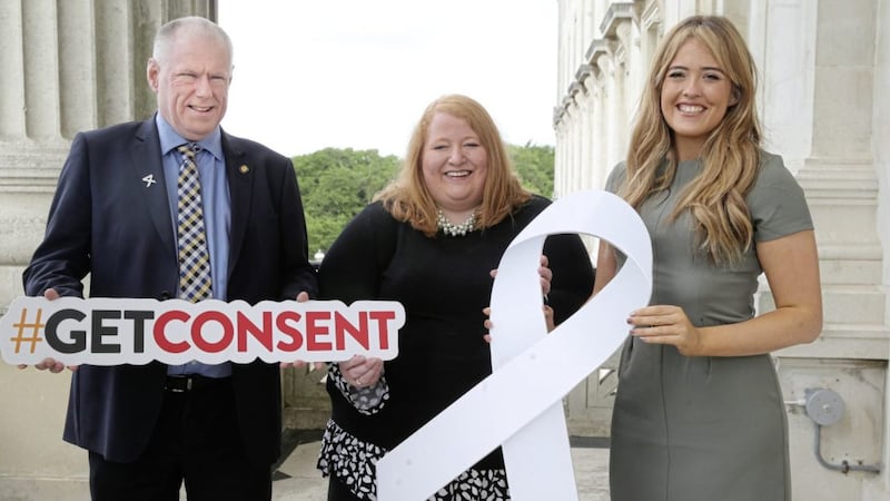 Brian McAvoy of Ulster GAA, Alliance leader Naomi Long and Tahnee McCorry from White Ribbon at Stormont yesterday. Picture by Hugh Russell 