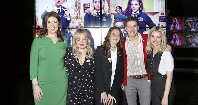 Writer Lisa McGee (left) joined the cast of Derry Girls (from left) Nicola Coughlan (Clare), Louisa Harland (Orla), Saoirse-Monica Jackson (Erin) and Dylan Llewellyn (James) at a preview in Derry last week. Picture by Margaret McLaughlin