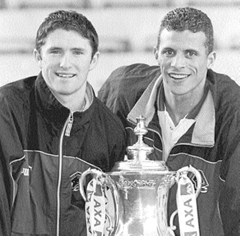 UNLIMITED VALUE... Robbie Keane (left) and Wolves team-mate Keith Curle pose with the FA Cup ahead of Sunday&rsquo;s tie with Arsenal 