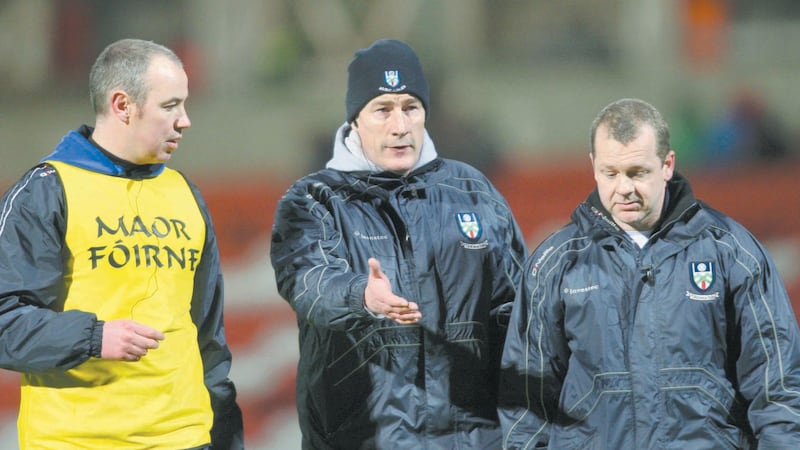Former Monaghan manager Eamon McEneaney and officials leave the pitch after the National Football League clash against Derry in March 2012 at Celtic Park
