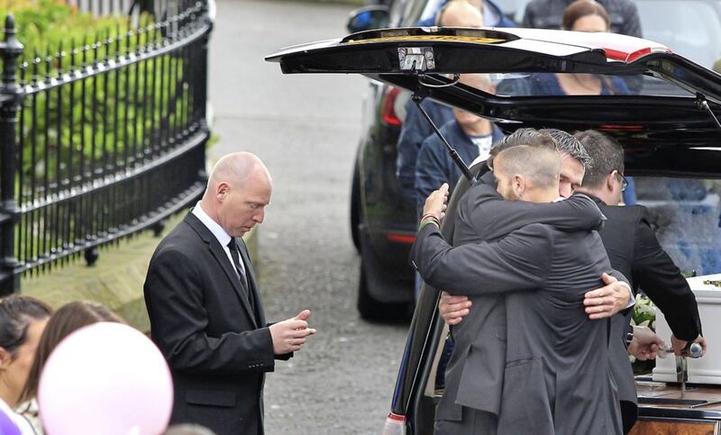 Mourners comfort each other at the funeral of Donnacadh Maguire. Picture by Margaret McLaughlin 
