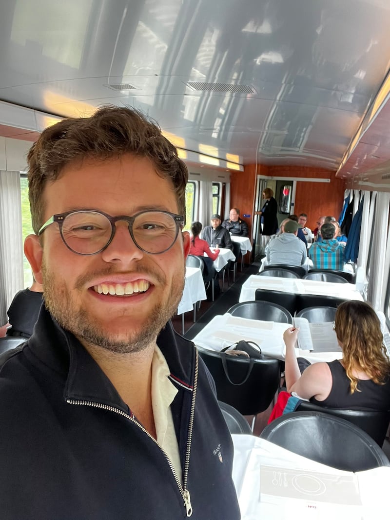 Man taking selfie on a train