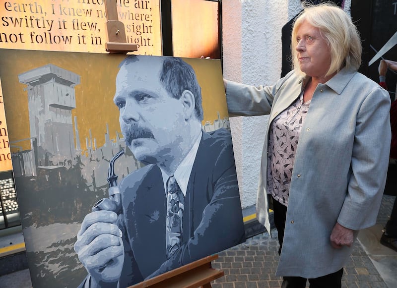David Ervine's wife Jeanette with a portrait of her husband, painted by their son Mark. Picture by Hugh Russell