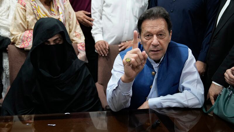 Imran Khan and his wife Bushra Bibi were convicted of a charge that their 2018 marriage violated the law (KM Chaudary/AP)