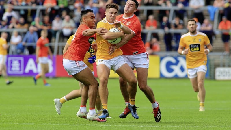 4/7/2021  Antrims  Eoghan Mc Cabe    in action with  Armaghs  Jemar Hall and Stefan Campbell    in yesterdays Ulster Championship Football game at the Athletic Grounds     Picture   Seamus Loughran 