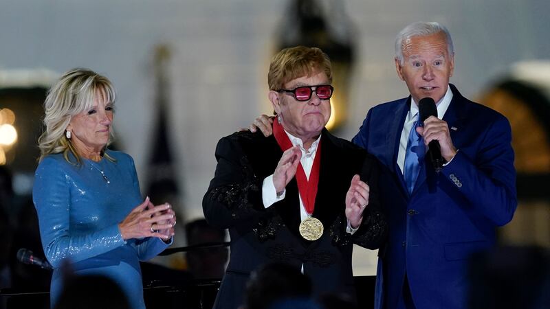 The multiple-Grammy winner was awarded the National Humanities Medal by Joe Biden for his commitment to end Aids.
