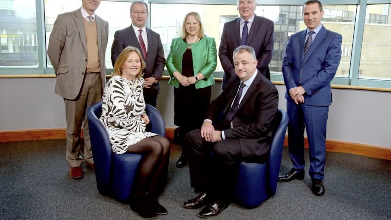 WIB chief executive Roseann Kelly (seated) with John Healy. At back (from left) are David Gavaghan, Professor Patrick Johnston, Imelda McMillan, Sir Malcolm McKibbin and Ray Hutchinson 