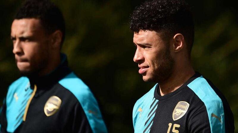               Arsenal&#39;s Alex Oxlade-Chamberlain (right) during the training session at London Colney Training Ground, Hertfordshire. PRESS ASSOCIATION Photo. Picture date: Monday September 28, 2015. See PA story SOCCER Arsenal. Photo credit should read: Adam Davy/PA Wire             