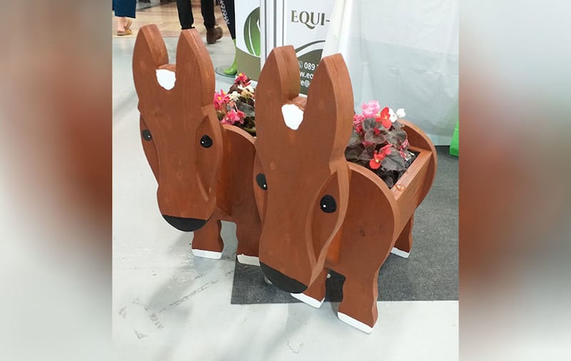 &nbsp;Horse shaped flower planters are among the many equestrian themed items for sale in the exhibition hall in the RDS. Picture by Maeve Connolly