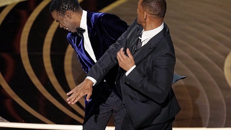 Will Smith, right, came on to the stage to hit Chris Rock at the Academy Awards ceremony in March. Picture by AP Photo/Chris Pizzello 