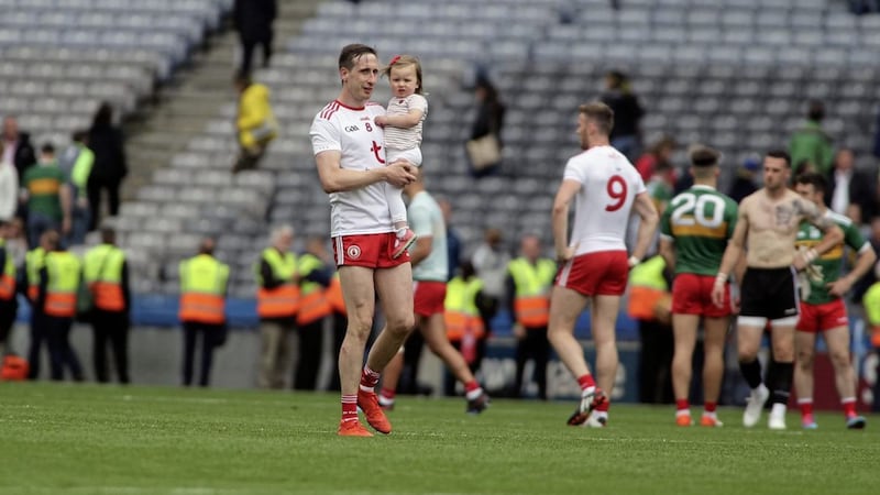 Tyrone&#39;s Colm Cavanagh with his daughter Chloe after the final whistle against Kerry last year Picture: Seamus Loughran. 