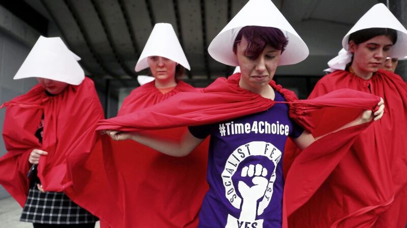 Women dressed as &#39;Handmaids&#39; in reference to the recent TV adaptation of Margaret Atwood&#39;s dystopian novel of The Handmaid&#39;s Tale, at a pro-choice rally in Dublin earlier this month Picture: PA 