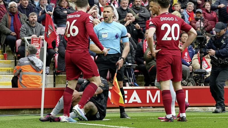 Liverpool&#39;s Andrew Robertson appeals to assistant referee Constantine Hatzidakis during the Premier League match against Arsenal at Anfield on Sunday. The pair clashed controversially at half-time.