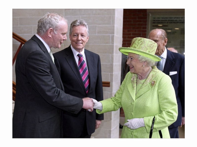 Queen Elizabeth shakes hands with Martin McGuinness