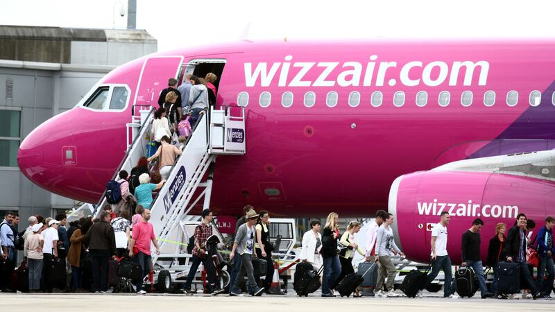 Passengers getting on a Wizz Air plane at Luton Airport (Steve Parsons/PA)