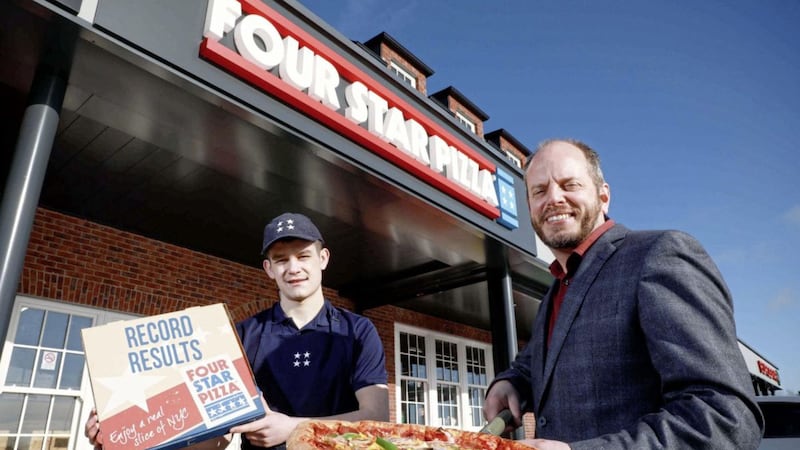 Four Star Pizza employee Jack Morris with the company&#39;s director, Brian Clarke 