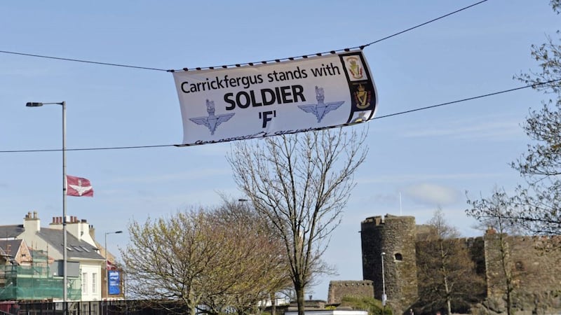 A banner supporting a former British soldier due to face prosecution for the murder of two men on Bloody Sunday has been put up in Carrickfergus, Co Antrim 
